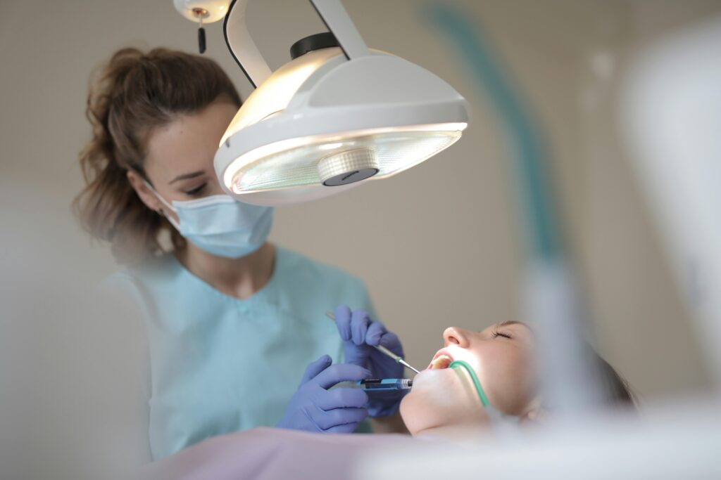 women at dentist under dental sedation