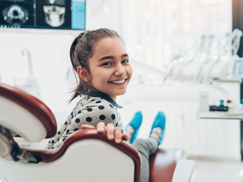 a female kid on a dental clinic