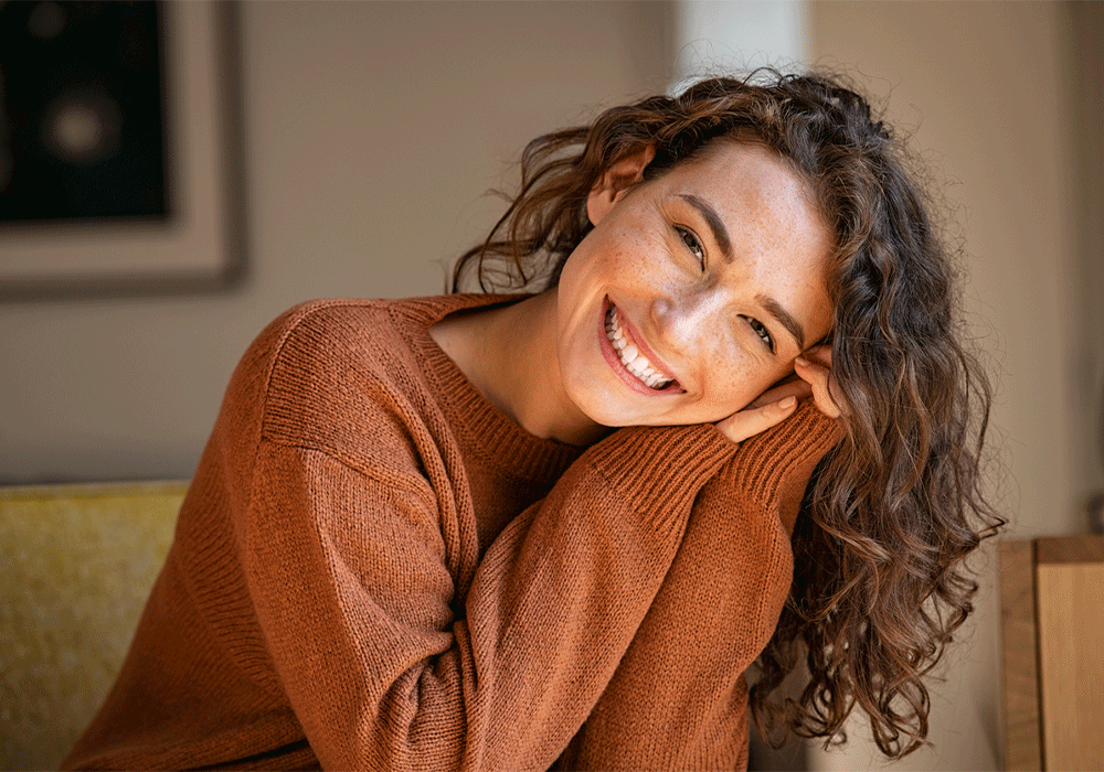 woman smiling with her head tilted